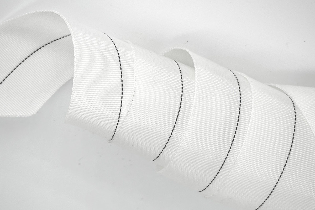 Nylon curing tape wrapping over the transfer label on a rubber hose