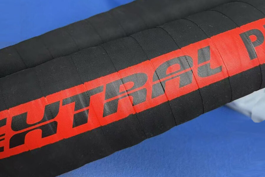 Finished hydraulic hose with permanently bonded vulcanized transfer label, abrasion resistant and durable