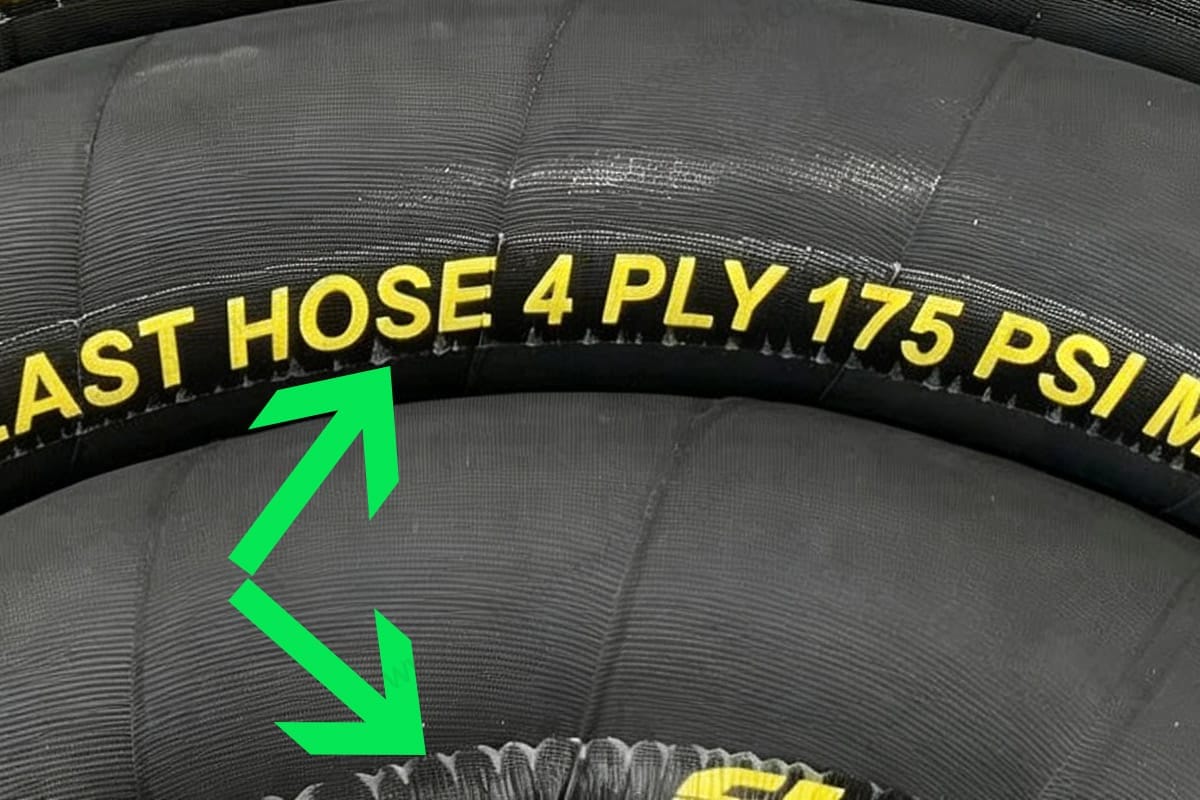 Failed hose label showing edge lifting after vulcanization curing